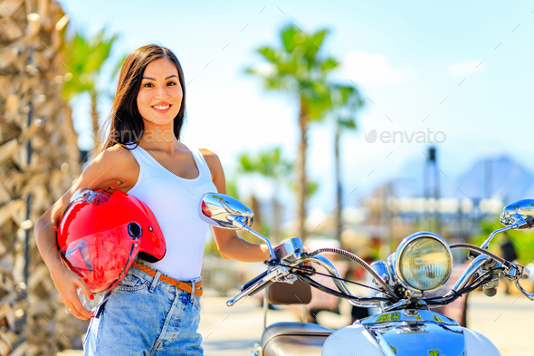 beautiful woman scooter rider drive a bike enjoy her tropicals weekends