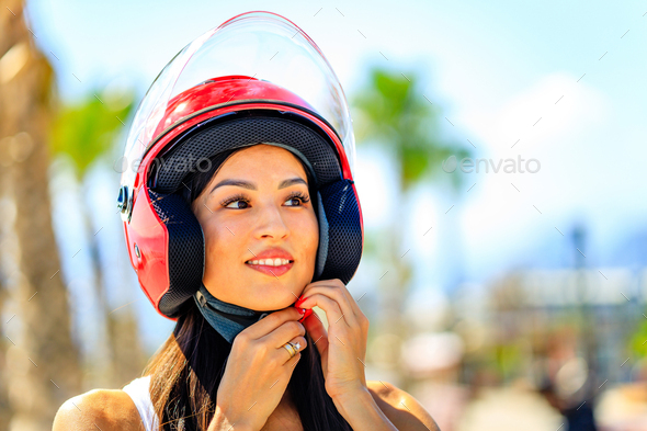 beautiful woman scooter rider drive a bike enjoy her tropicals weekends