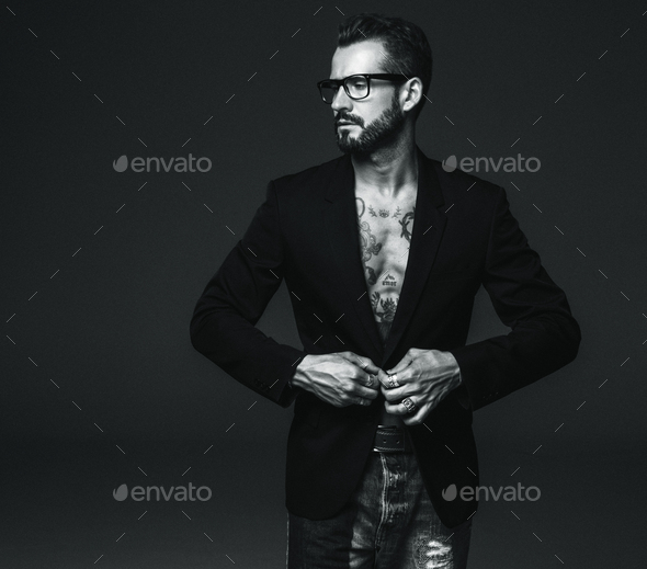 Handsome man posing in studio - Stock Photo - Images