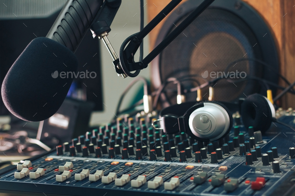 Radio host microphone, mixing console and headphones close-up - Stock Photo - Images