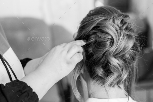 The barber makes hairstyle for bride. The fees of the bride. Black-white. - Stock Photo - Images