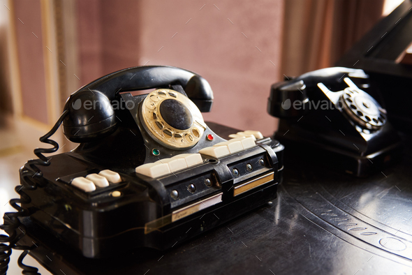 Vintage black phone on the table - Stock Photo - Images