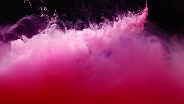 Abstract Of Pink Liquid Swirling Against Black