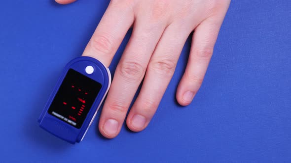 Closeup of Hand with Heart Rate Monitors for Measuring Pulse and Heart Rate