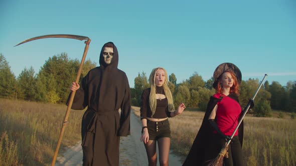 Evil Creatures Walking on Dirt Road on Halloween alt