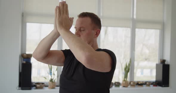 Professional Trainer Practices Flow Yoga in Private Class alt