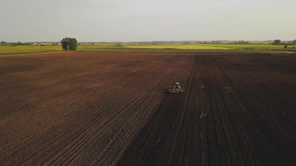 Aerial Drone Shot of a Farmer Spraying Soybean Fields alt