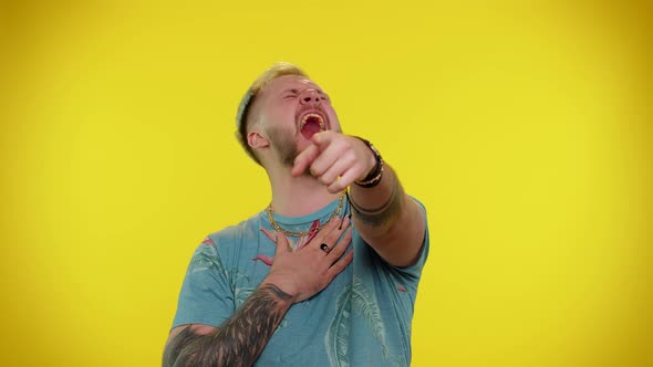 Man Pointing Finger to Camera Laughing Out Loud Making Fun of Ridiculous Appearance Funny Joke alt