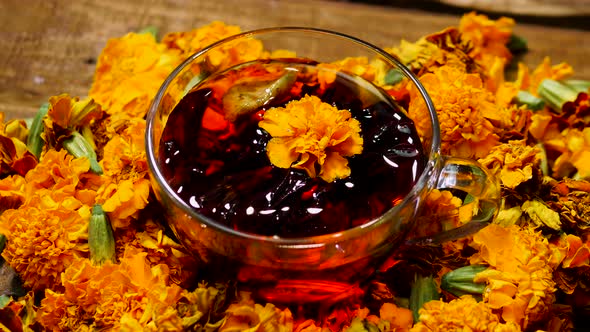 Antioxidant Natural Tea From Marigold Flowers From Above, Tea For Colds. Naturotherapy Drink