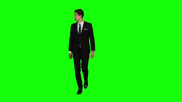 Man Is Going To a Business Meeting and Waving Greetings. Green Screen alt