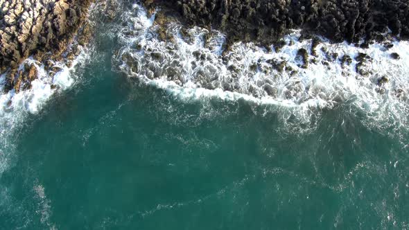 Aerial Footage of Waves breaking on the rocks