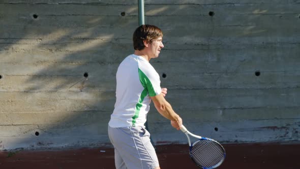 Active man playing tennis alt