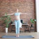 Pregnant Lady Does Breathing Exercises Raising Hands at Home