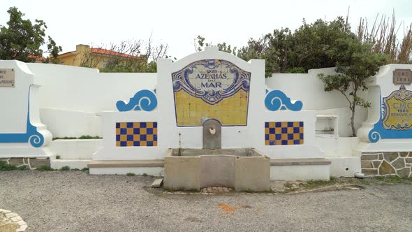 Fountain in Azenhas do Mar Village on a Cloudy Day