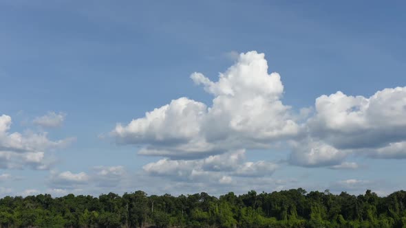 Time lapse of clouds in blue sky alt