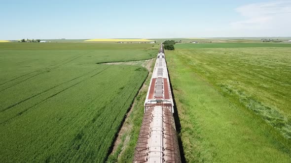 Aerial Footage Slow Moving Near Tops Of Idle Train Cars