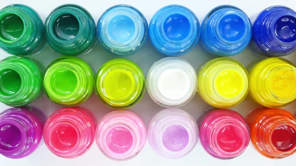 Top View Of Poster Colors In Square On White Background alt