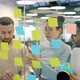 Creative Team of Business People Sticking Notes on Glass Board Brainstorming in Office - VideoHive Item for Sale