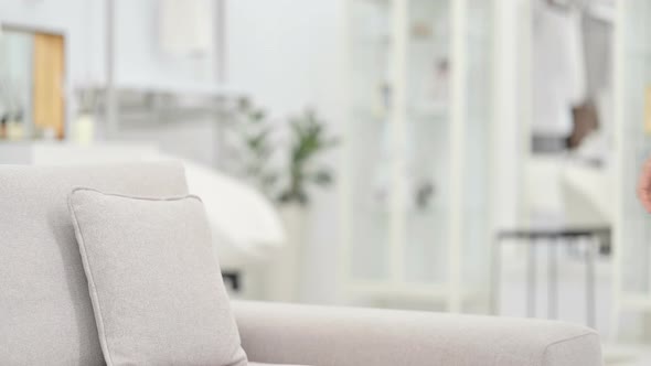 African Woman Coming and Starting Laptop Work on Sofa  alt