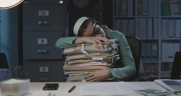 Tired office worker sleeping at work