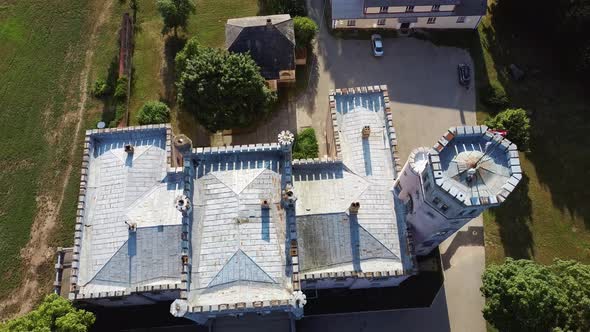 Vecauce Manor in Latvia Aerial View of the Pink Castle Through the Park. Vecauce Castle Tower With a alt