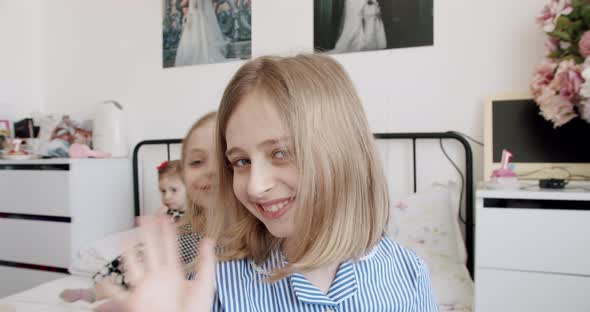 A Birthday Party for a Cute 1 Year Old Girl Surrounded By Her Older Sisters alt