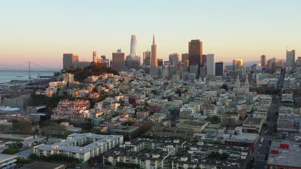 Forward Aerial Pan of San Francisco Skyline and Golden Gate Bridge at Sunset alt