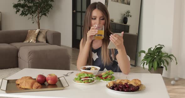 Beautiful Woman Is Having Breakfast at Home.