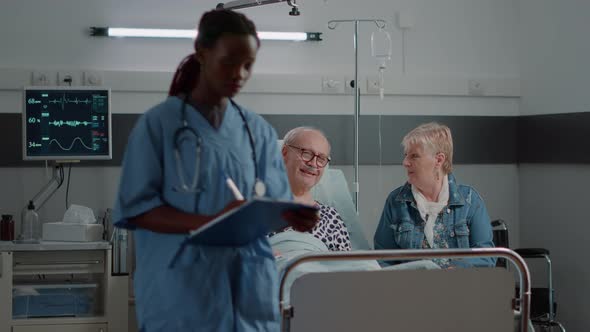 Little Kid and Woman Bringing Flowers to Old Patient at Family alt