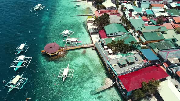 Boardwalk With Boats Moored On Tropical Coastal Island Of Cebu At Moalboal Philippines alt