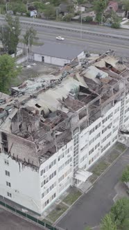 Vertical Video of a Wardamaged Apartment Building in Ukraine alt