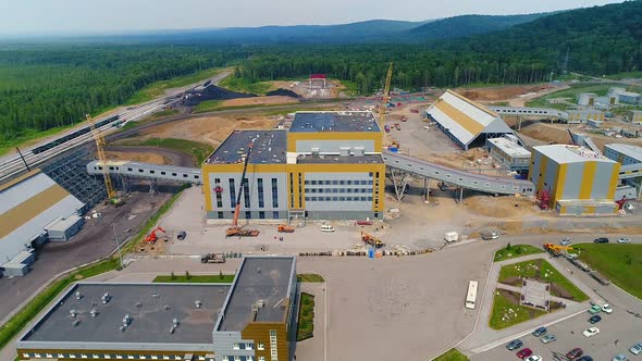 Industrial Building Under Construction on the Background of the Forest alt