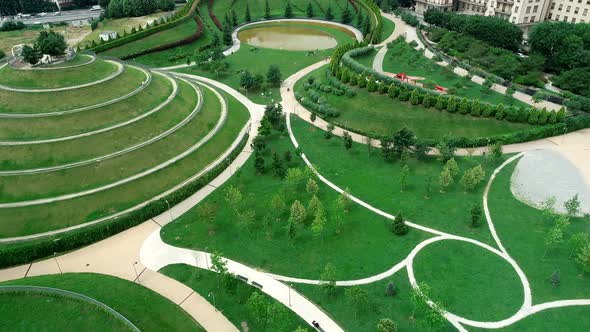 Aerial view of city and park 4k alt