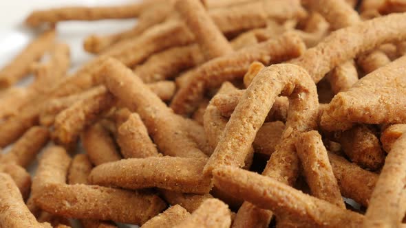 Close-up of grissini with chilli 4K 2160p 30fps UltraHD panning footage - Tasty integral breadsticks alt