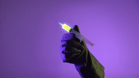 Syringe With A Glowing Liquid