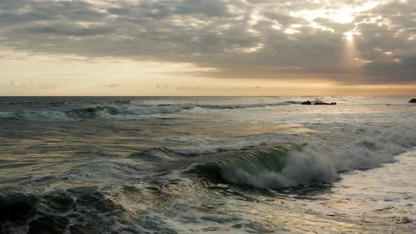 Large waves in the ocean at sunset