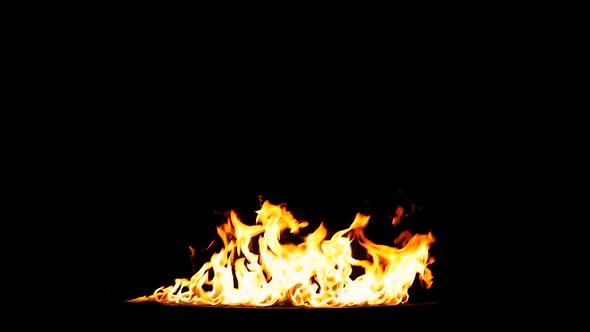 A huge line of flames swelling up by wind. Real Fire shot in 50 fps alt