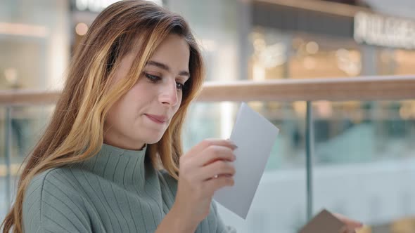 Caucasian Woman Girl Indoors Received Mail Correspondence Take Out Letter From Envelope Read Good alt