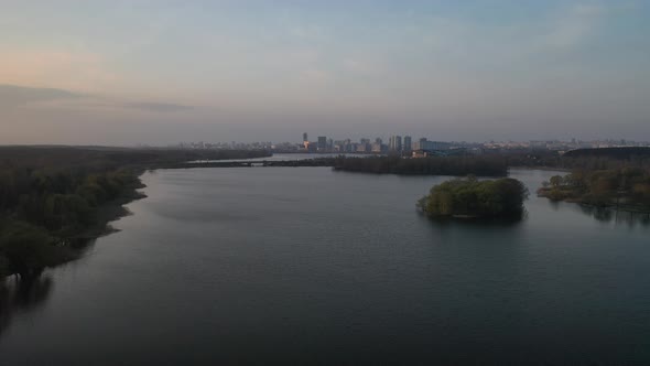 Dawn From a Height on the Lake Behind Which the City is Visible