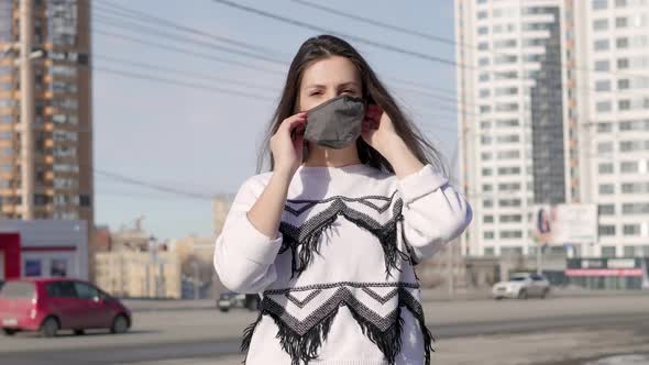 Woman Putting on Surgical Mask for Corona Virus Prevention.