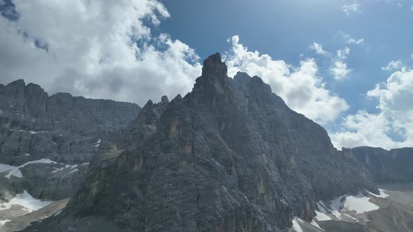 Hikers and travelers enjoy the beautiful mountain views as they have a walk in the Dolomites alt