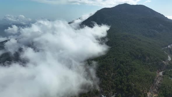 Cloudy landscape high in the mountains aerial view 4 K alt