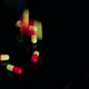 Closeup of Pills Falling on Black Table Slow Mo - VideoHive Item for Sale