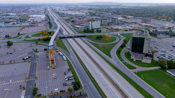 4K camera drone view of the construction site of the REM by highway 40 in Pointe Claire, Montreal.