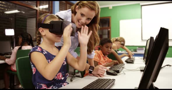 Schoolgirl using virtual reality glasses in classroom alt