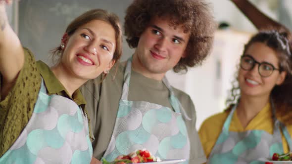 Cheerful Multiethnic Friends Taking Selfie during Cooking Master Class alt