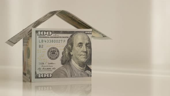 Roof putting on USD paper currency made home  4K 2160p 30fps UltraHD footage - Close-up finishing of alt