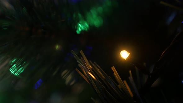 Many Christmas tree colorful bulbs blinking in the dark 4K 2160p 30fps UHD footage - Fairy lights se alt