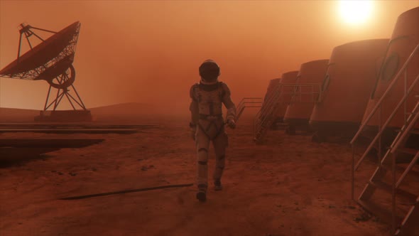Astronaut on the Planet Mars Making a Detour Around His Base alt