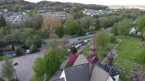 Church Tower And Lerum Cityscape in Sweden Aerial Orbit